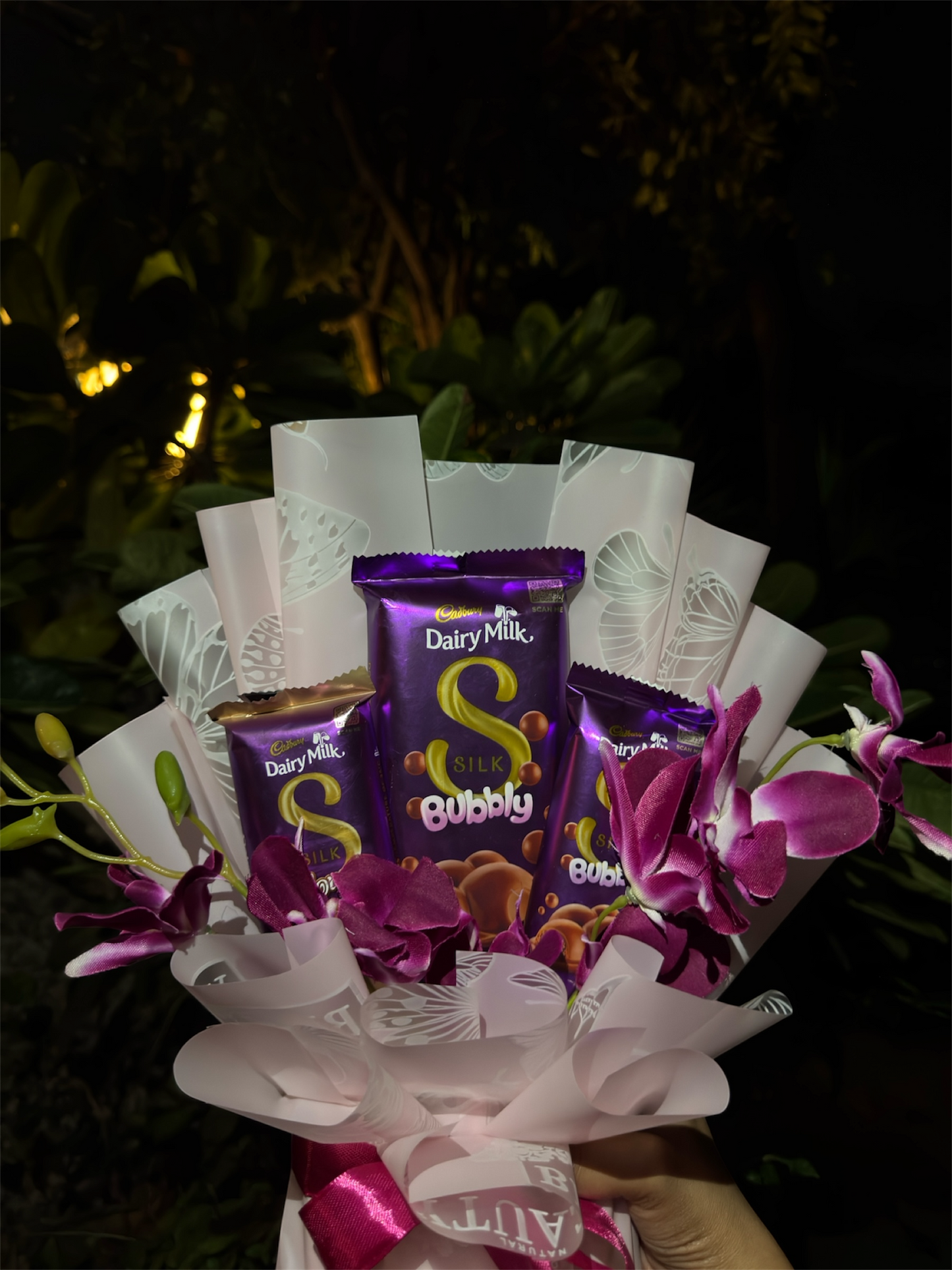 Dairy Milk Silk & Orchid Bouquet – A Touch of Sweet Pink Elegance
