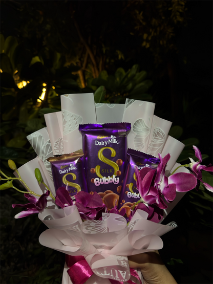 Dairy Milk Silk & Orchid Bouquet – A Touch of Sweet Pink Elegance