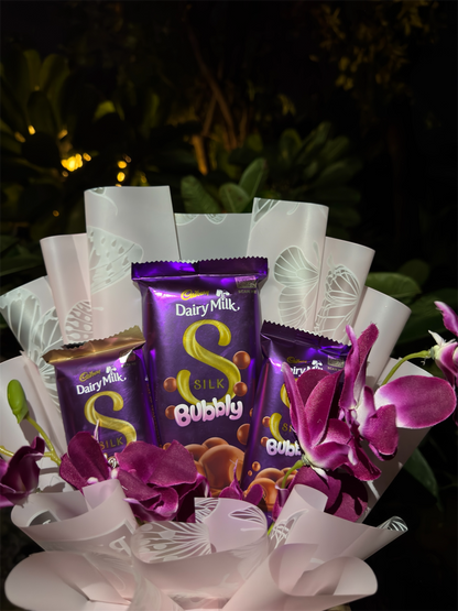 Dairy Milk Silk & Orchid Bouquet – A Touch of Sweet Pink Elegance